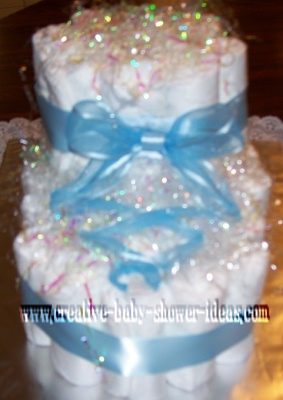 bootie diaper cake with blue satin ribbon tied like a shoe