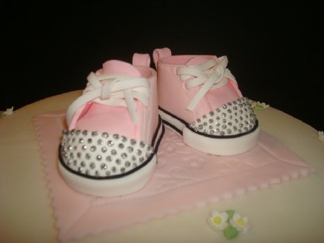 closeup of pink and baby sneakers with edible rhinestones