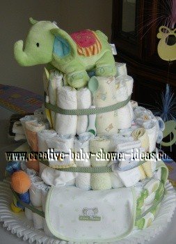 gender neutral baby diaper cake with light green elephant and decorations throughout