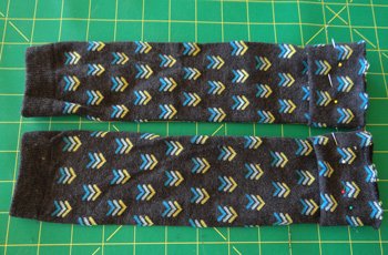 2 socks pinned and ready to be sewn to make baby leggings