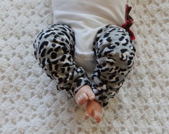 a 3 month old baby modeling finished baby leg warmers