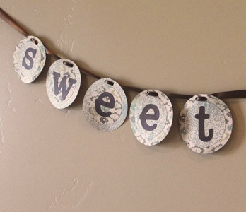 finished baby shower banner with closeup on the word sweet