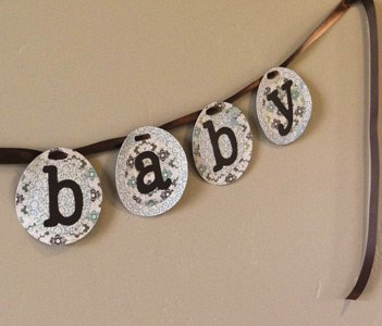 finished baby shower banner with closeup on the word baby