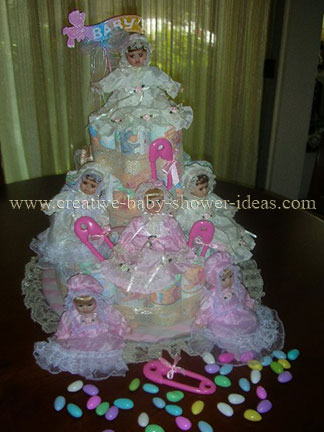 closeup of porcelian dolls on diaper cake