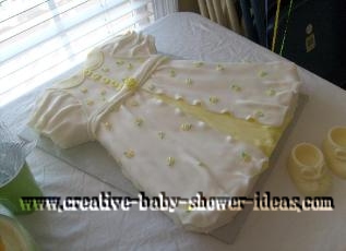 yellow and white floral baby dress cake