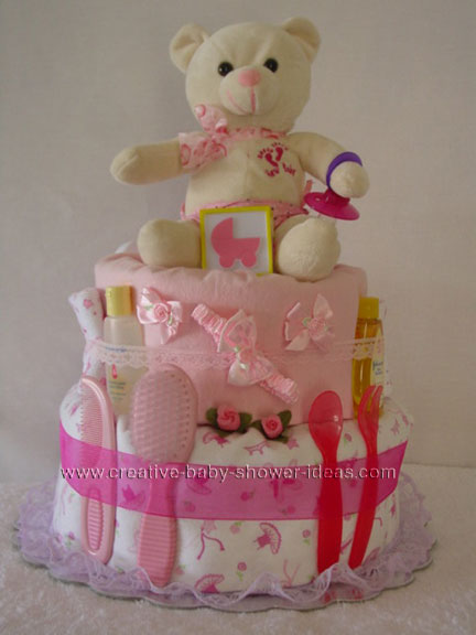 cream and pink teddy bear carriage diaper cake