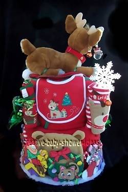 side of christmas diaper cake showing bib and baby clothing