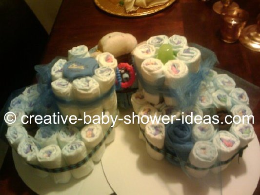 matching white and blue diaper bootie cakes