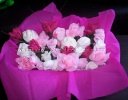 pink white and purple baby clothes bouquet