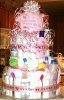 thank heaven for little girls diaper cake with pink bows and baby spoons