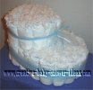 white bootie diaper cake tied with blue tulle