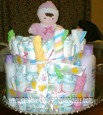 baby doll and washcloths diaper cake