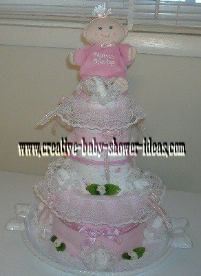 pink doll and lace diaper cake