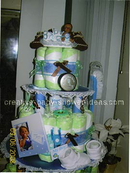 boy doll diaper cake with picture frame booties