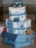 3 tier diaper cake with green and blue stripes and green rubber ducky