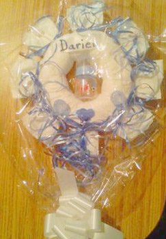 blue and white curling ribbon diaper wreath
