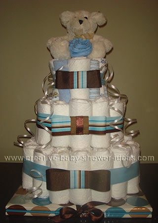 cream bear baby shower diaper cake with blue and brown accents
