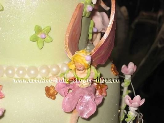 closeup of the fairies on the garden baby cake