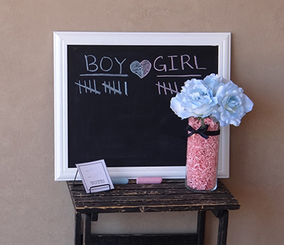white and black chalkboard for gender reveal party