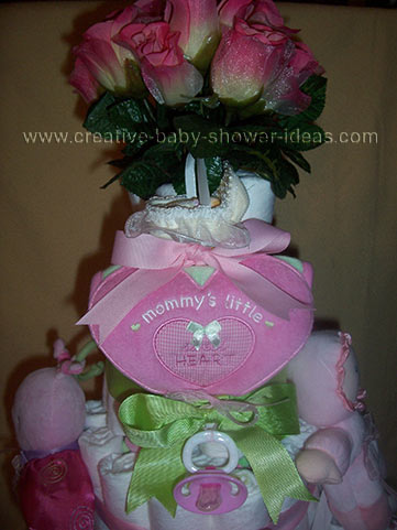 pink and green mommy's little sweetheart girl diaper cake