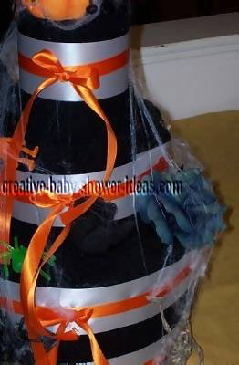 closeup halloween towel cake showing cobwebs and black flowers