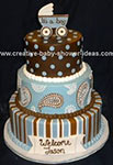 modern blue and brown baby shower cake with stripes paisley and polka dot designs