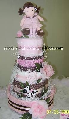 mod doll diaper cake on baby shower table