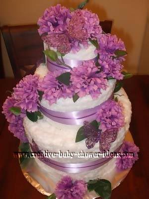 purple and white carnations and butterflies wedding towel cake