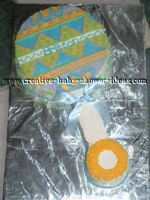 green blue and pink baby rattle cake