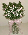 pink and white sock rose baby bouquet with baby's breath