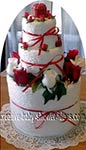 red and white flower towel cake