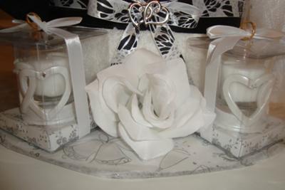bottom of wedding towel cake with wedding candles