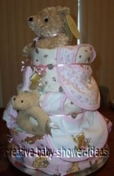 side view of pink blankets winnie the pooh diaper cake