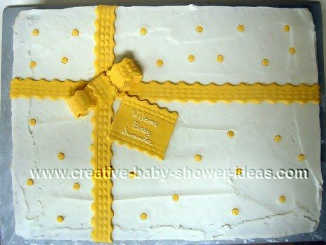 yellow and white present cake