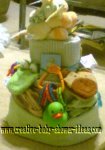 green and yellow frogs and monkeys diaper cake