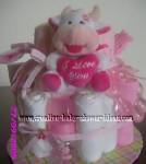 pink and white cow diaper cake with I love you heart