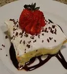 baby shower dessert with pudding whipped topping and sliced strawberries