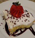 baby shower dessert with pudding whipped topping and sliced strawberries