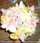 pastel baby sock rose and clothing bouquet
