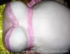 pink and white pregnant belly cake