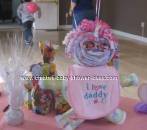 pink and purple diaper baby with i love daddy bib 
