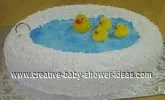 rubber ducks in a bathtub baby shower cake