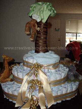 side of monkey diaper cake showing gold ribbon bows