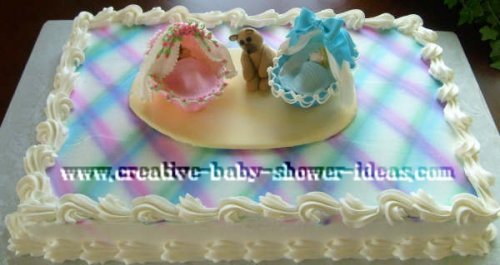 pink and blue plaid baby shower bassinet cake