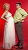 funny picture of pregnant woman and spouse comparing belly sizes