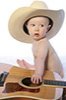 a naked baby with a cowboy hat and guitar facing away from camera