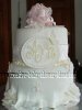 white fondant butterfly cake with a sign that says Ava