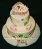green and pink polka dot sleeping baby bassinet cake