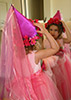 little girl dressed like a princess looking in the mirror
