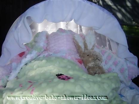 closeup of bunny rabit sleeping insed diaper bassinet cake